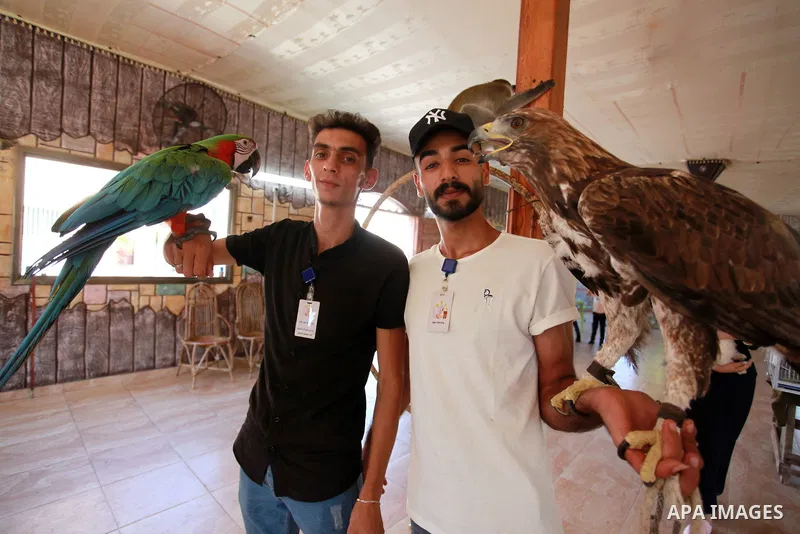 Palestinians attend a pet exhibition during the third day of Eid al-Adha festival celebrated by Muslims worldwide, in Gaza City on July 22, 2021. The al-Adha, or "Feast of Sacrifice", marks the end of the annual pilgrima...