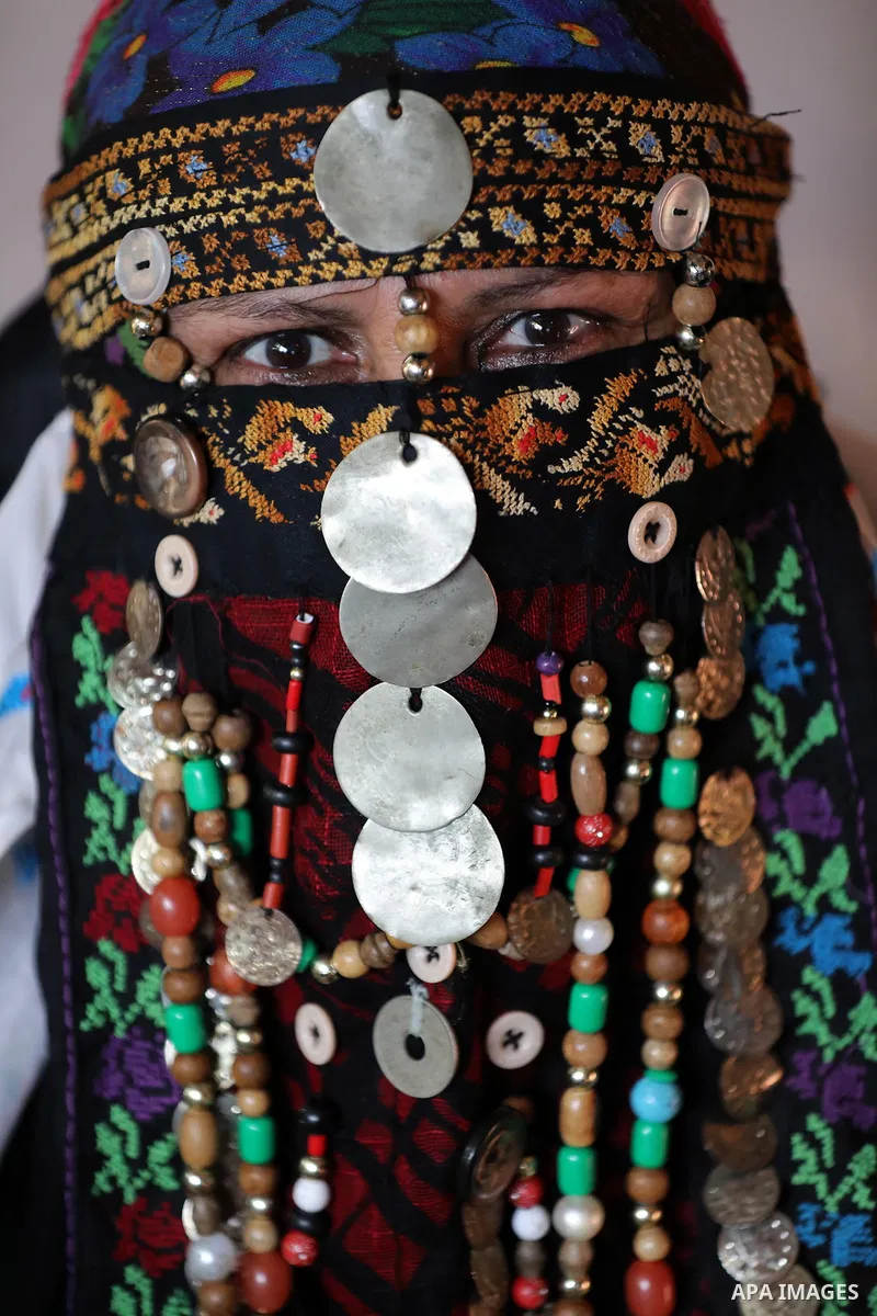 Palestinians attend an event marking the Palestinian traditional costume day, in Khan Younis in the southern Gaza Strip, on July 25, 2021. Palestinian costume are the traditional clothing worn by Palestinians. Foreign tr...