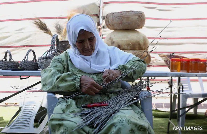 Palestinians take part on the opening day of the Beita market, in the West Bank village of Beita, near Nablus on July 27, 2021. The Palestinian ministry of culture launched the first market of the Cultural Capital Market...