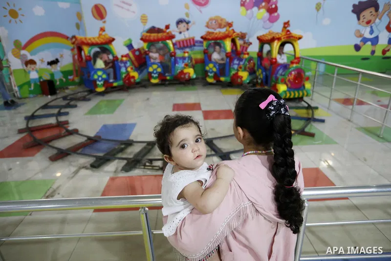 Palestinian children who their relatives killed by Israeli airstrikes during the recent conflict between Israel and Hamas attend a fun day, in Gaza City, on July 28, 2021. The Gaza Strip remains in ruins two months after...