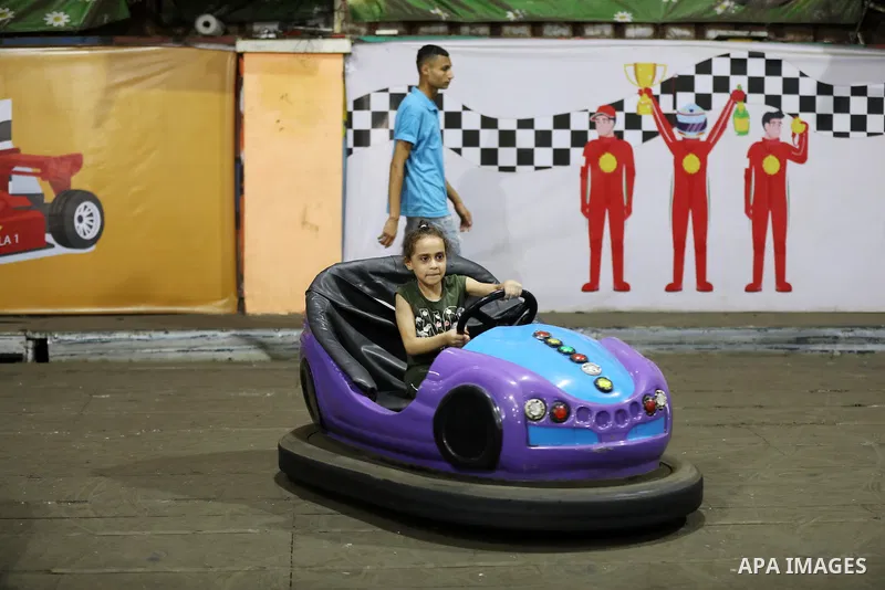 Palestinian children who their relatives killed by Israeli airstrikes during the recent conflict between Israel and Hamas attend a fun day, in Gaza City, on July 28, 2021. The Gaza Strip remains in ruins two months after...