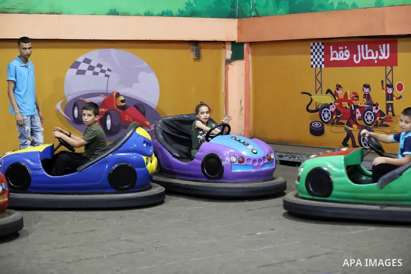 Palestinian children who their relatives killed by Israeli airstrikes during the recent conflict between Israel and Hamas attend a fun day, in Gaza City, on July 28, 2021. The Gaza Strip remains in ruins two months after...