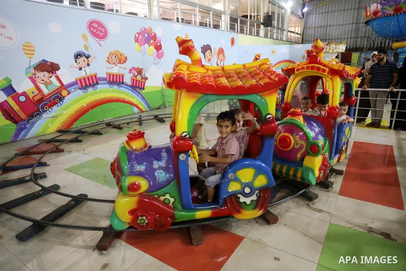 Palestinian children who their relatives killed by Israeli airstrikes during the recent conflict between Israel and Hamas attend a fun day, in Gaza City, on July 28, 2021. The Gaza Strip remains in ruins two months after...