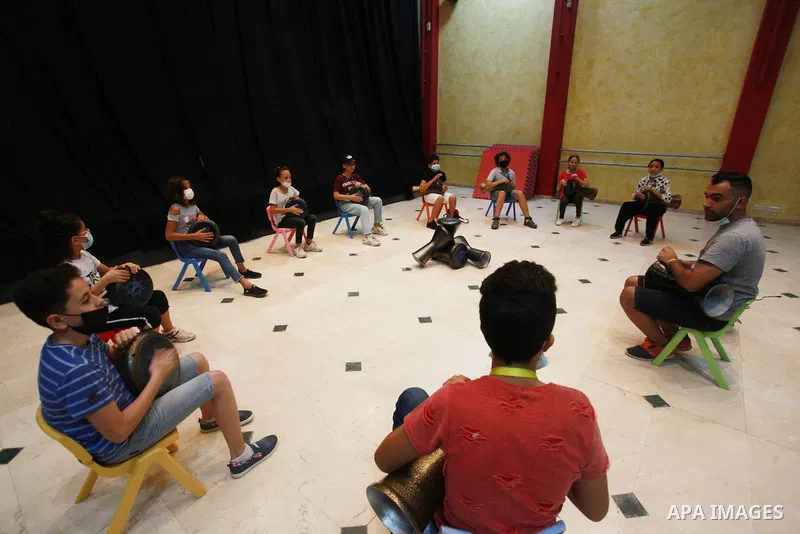 Palestinian children attend a class to learn Darbuka (goblet drum) at Qattan Foundation in Gaza city on July 29, 2021. With schools shuttered due to coronavirus and the summer hiatus, Gaza's children have little to keep...