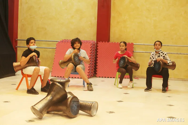 Palestinian children attend a class to learn Darbuka (goblet drum) at Qattan Foundation in Gaza city on July 29, 2021. With schools shuttered due to coronavirus and the summer hiatus, Gaza's children have little to keep...
