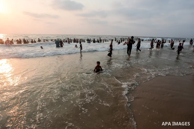 Palestinians enjoy the beach of the Mediterranean sea in Gaza City, on July 30, 2021. The beach is one of the few open public spaces in this densely populated city. Photo by Mohammed Dahman