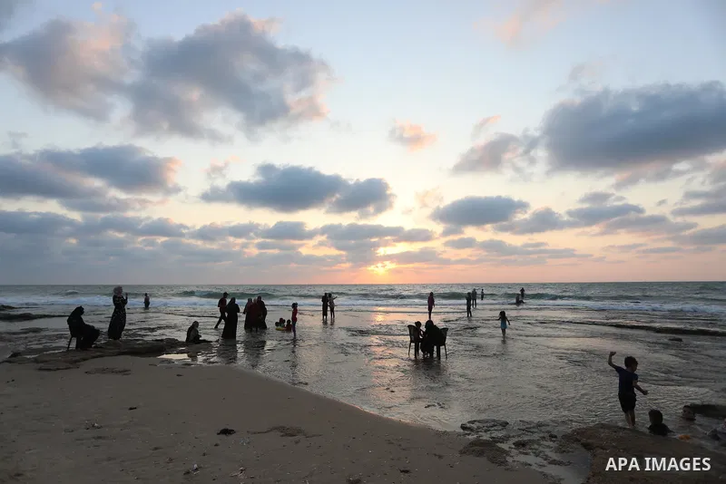 Palestinians enjoy the beach of the Mediterranean sea in Gaza City, on July 31, 2021. The beach is one of the few open public spaces in this densely populated city. Photo by Ashraf Amra