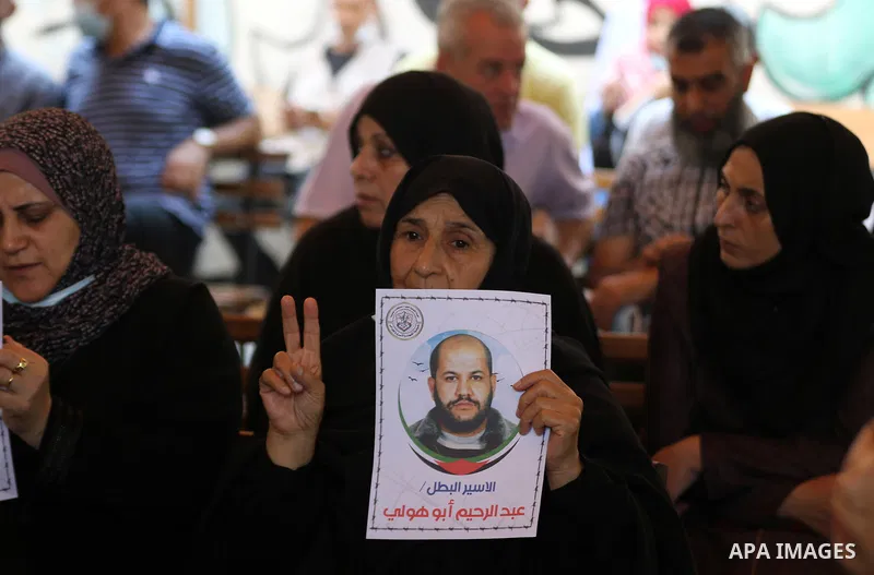 Palestinians take part in a protest to show solidarity with prisoners on hunger strike in Israeli Jails, in front of the headquarters of Red cross in Gaza city on August 02, 2021. A total of 17 Palestinian prisoners in I...
