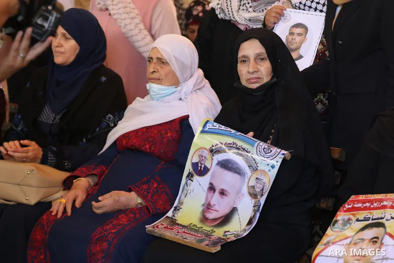 Palestinians take part in a protest to show solidarity with prisoners on hunger strike in Israeli Jails, in front of the headquarters of Red cross in Gaza city on August 02, 2021. A total of 17 Palestinian prisoners in I...