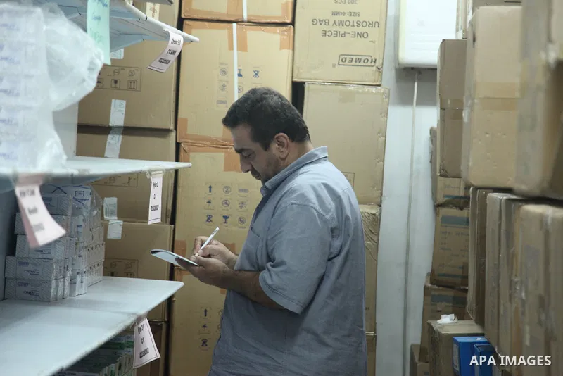 Employees of the Palestinian Ministry of Health in the Gaza Strip count the missing medicines due to Israel's continued closure of the border crossings, inside the warehouses of the Ministry of Health in Gaza City, on Au...