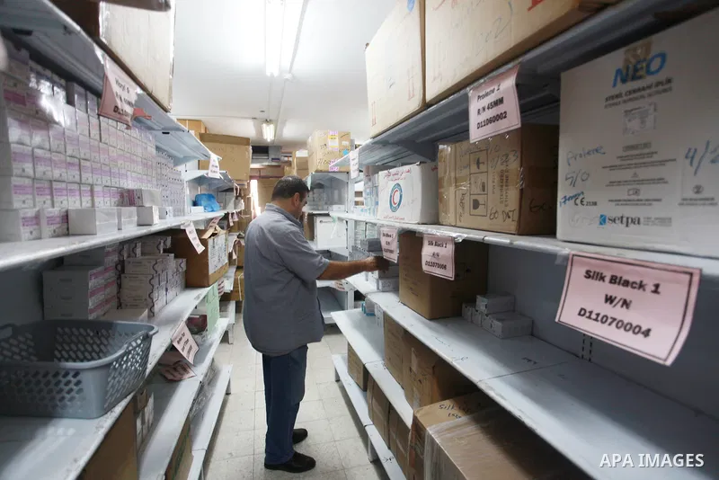 Employees of the Palestinian Ministry of Health in the Gaza Strip count the missing medicines due to Israel's continued closure of the border crossings, inside the warehouses of the Ministry of Health in Gaza City, on Au...