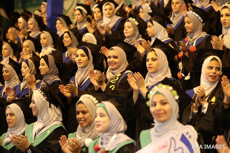 A picture taken on August 1, 2021 shows Palestinian students attend their graduation ceremony at University College of Applied Sciences (UCAS), in Gaza city. Photo by Ashraf Amra