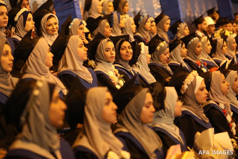 A picture taken on August 1, 2021 shows Palestinian students attend their graduation ceremony at University College of Applied Sciences (UCAS), in Gaza city. Photo by Ashraf Amra