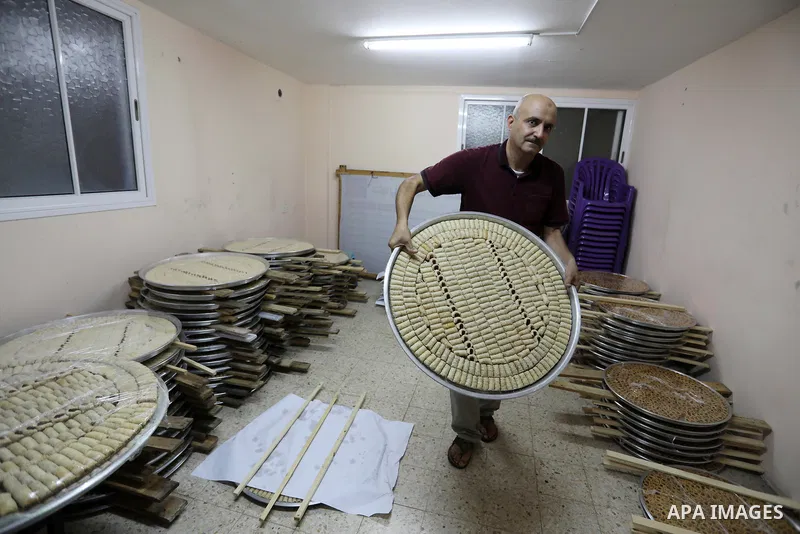 Palestinian vendors prepare sweets a day before high school exams "Tawjihi" results at a factory in Gaza city on August 2, 2021. The Ministry of Education in the West Bank and Gaza Strip announced that high school result...