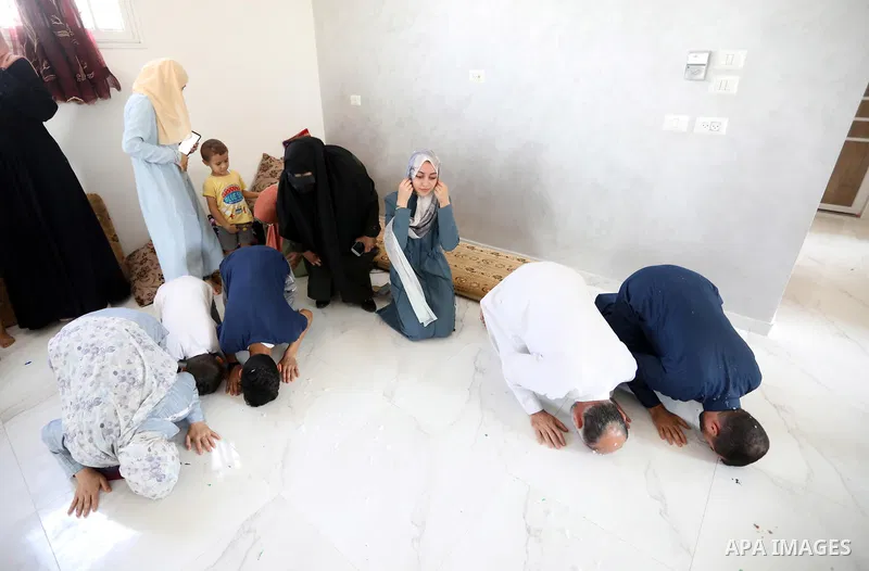 A Palestinian high school female student, Alaa Ahmed, 99.7%, celebrates with her family after heard the results of her final exams known as ''Tawjihi'', in Khan Younis in the southern of Gaza strip on August 3, 2021. Pho...