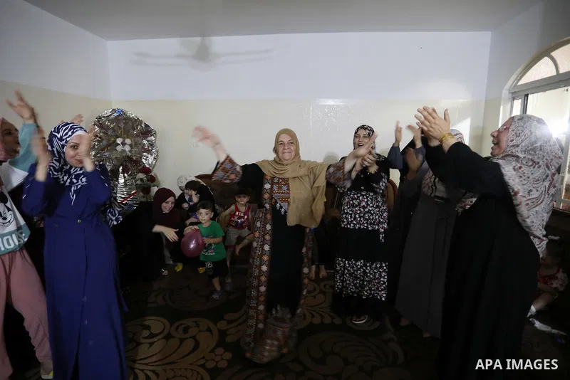 A Palestinian high school female student, lama Zaqot, 99.7%, celebrates with her family after heard the results of her final exams known as ''Tawjihi'', in Khan Younis in the southern of Gaza strip on August 3, 2021. Pho...