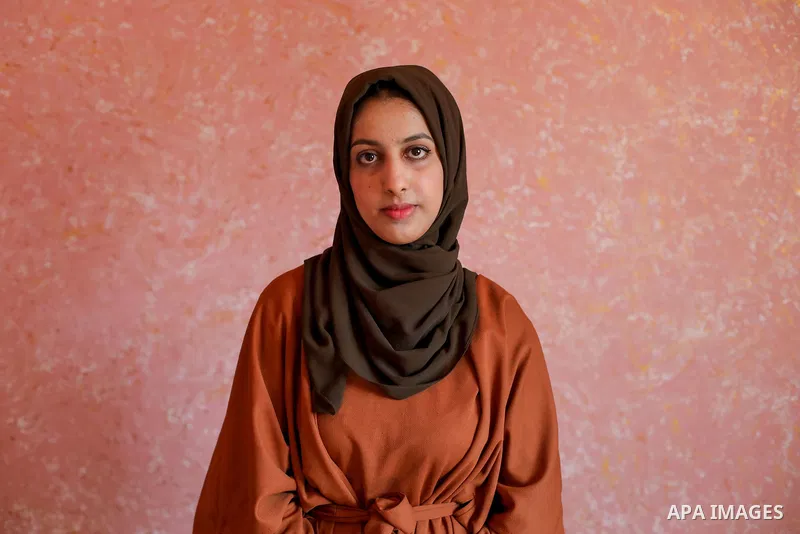 A Palestinian high school female student, Sujood al-Naami, 99.7%, celebrates with her family after heard the results of her final exams known as ''Tawjihi'', in al-Maghazi refugee camp, central Gaza Strip on August 3, 20...