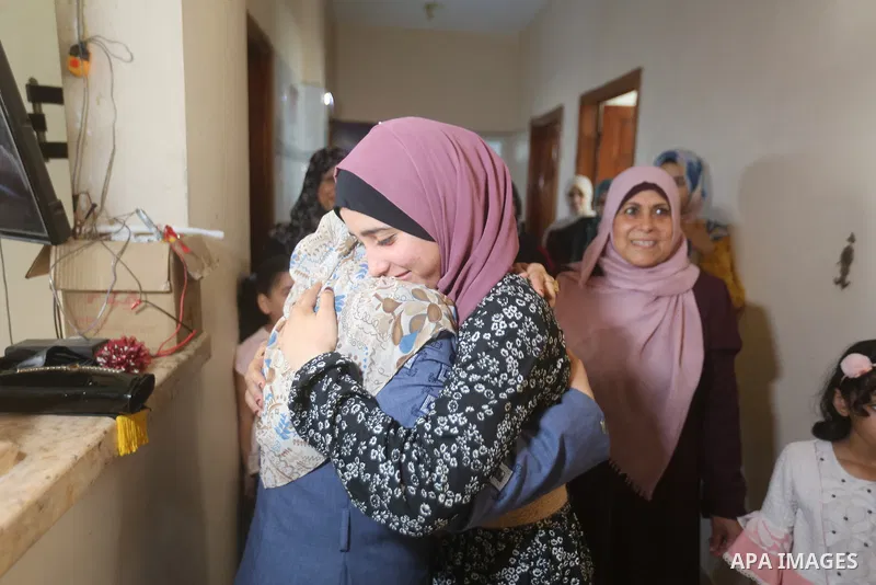A Palestinian high school female student, Rahaf Mahdi, 99.7%, celebrates with her family after heard the results of her final exams known as ''Tawjihi'', in the center of Gaza strip on August 3, 2021. Photo by Atia Darwi...