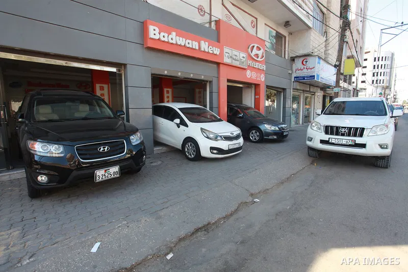 New cars are seen at a car show place amid Israel's import ban in Gaza city, on August 4, 2021. Palestinian traders and citizens of the besieged Gaza Strip complain of a "fatal stagnation" in the car trading amid an impo...
