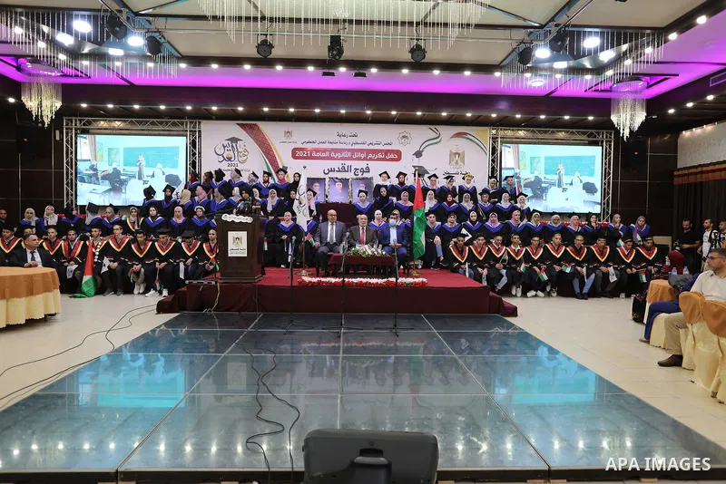 The high school Palestinian students, attend a honoring ceremony, in Gaza city, on August 4, 2021. It said announcing the results for 82,924 students who sat for the exam out of which 59,128 have passed it that despite t...