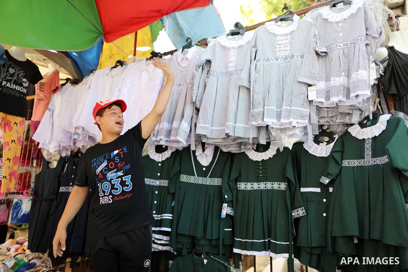 Palestinians shop during preparation for the new school year at a market in Gaza city, on 11 August 2021. The fiscal position in Gaza strip has worsened not only due to the outbreak but also due to a political standoff t...
