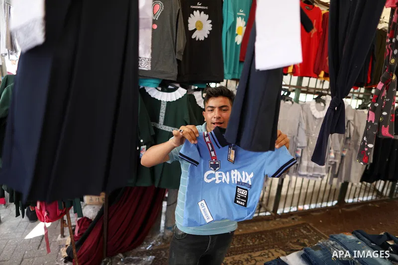 Palestinians shop during preparation for the new school year at a market in Gaza city, on 11 August 2021. The fiscal position in Gaza strip has worsened not only due to the outbreak but also due to a political standoff t...