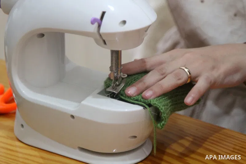 Palestinian Basma Mahmoud, 33, makes dolls Crochet Wool "Amigurami art" at her home in Gaza City, on August 12, 2021. Amigurami is a Japanese art that uses crochet or knitting to make dolls such as geometric shapes, food...