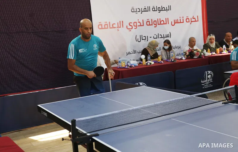 Disabled Palestinians play table tennis, organized by International Committee of the Red Cross at Al-Jazira Sports Club, in Gaza city on August 12, 2021. Almost 50,000 Palestinians are classified as "disabled" among the...