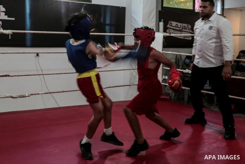 Palestinian youths in action during a boxing friendly tournament in Gaza city on August 20, 2021. Israel has continued its 14-year blockade against Gaza for reasons beyond the military and the strategic. The blockade cru...