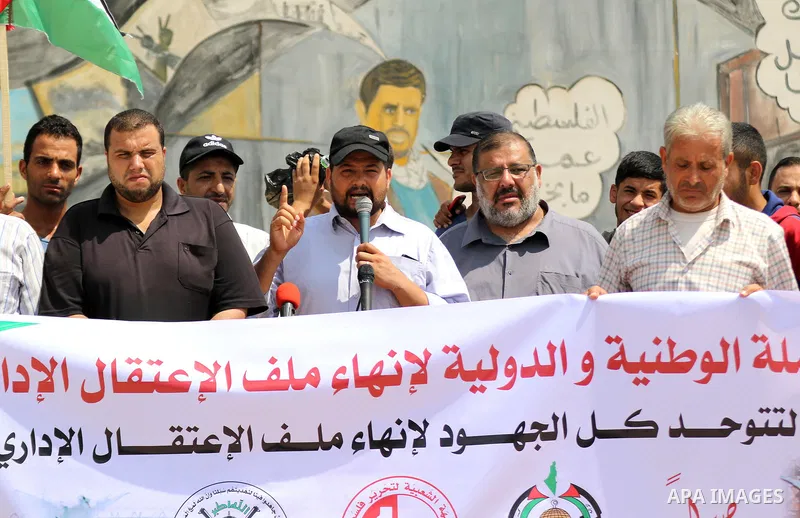 Palestinians take part in a protest to show solidarity with prisoners on hunger strike in Israeli Jails, in front of Erez crossing, in Beit Hanoun in the northern Gaza Strip, on August 22, 2021. Nine Palestinian prisoner...