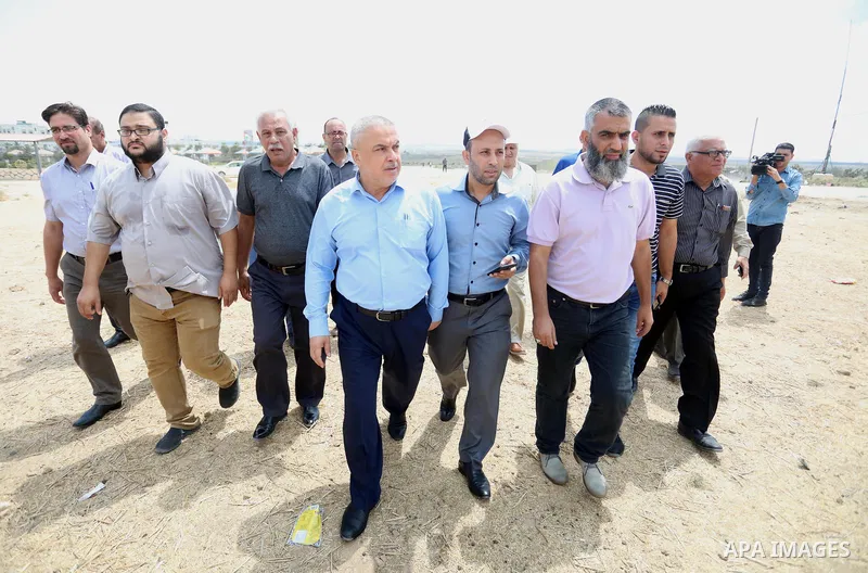 Palestinians members of National and Islamic forces hold a press conference near the Israel-Gaza border, east of Gaza City, denouncing the Israeli siege of the Palestinian strip, on August 22, 2021. Israeli fighter jets...