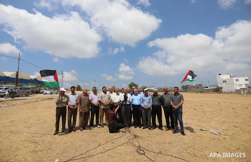 Palestinians members of National and Islamic forces hold a press conference near the Israel-Gaza border, east of Gaza City, denouncing the Israeli siege of the Palestinian strip, on August 22, 2021. Israeli fighter jets...