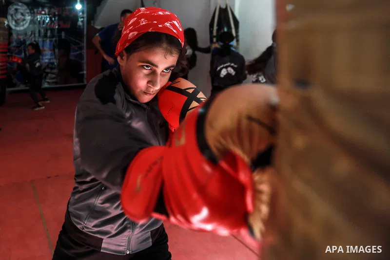 Palestinian coach Osama Ayoub trains girls in boxing in Gaza City, on August 22, 2021. Ayoub boxed all over the Arab world and when he returned to Gaza in 2013, he started introducing the sport to Palestinian women, init...