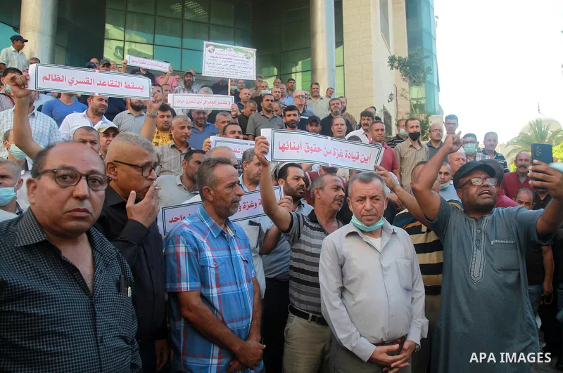 Palestinian military retirees take part in a protest to demand the cancellation of the Mandatory retirement law, in Gaza city, on August 23, 2021. Palestinian Prime Minister Mohammad Shtayyeh previously announced that 6,...