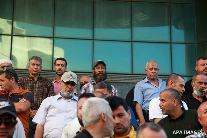 Palestinian military retirees take part in a protest to demand the cancellation of the Mandatory retirement law, in Gaza city, on August 23, 2021. Palestinian Prime Minister Mohammad Shtayyeh previously announced that 6,...