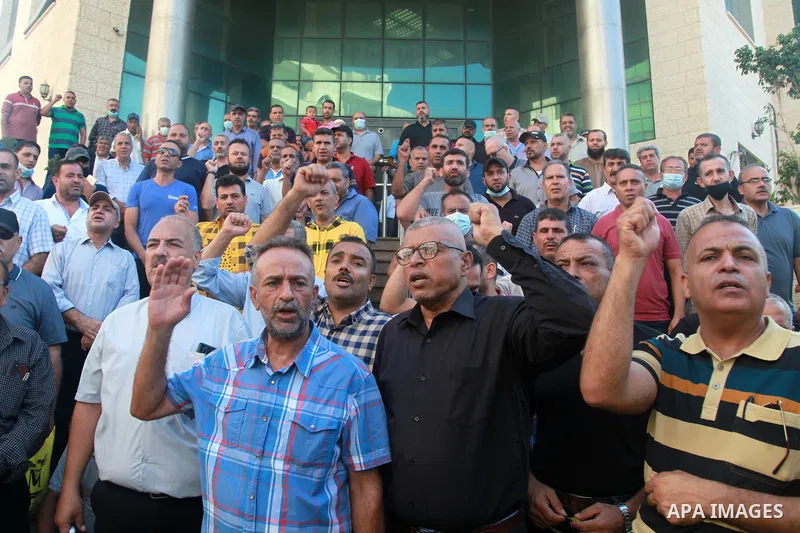 Palestinian military retirees take part in a protest to demand the cancellation of the Mandatory retirement law, in Gaza city, on August 23, 2021. Palestinian Prime Minister Mohammad Shtayyeh previously announced that 6,...