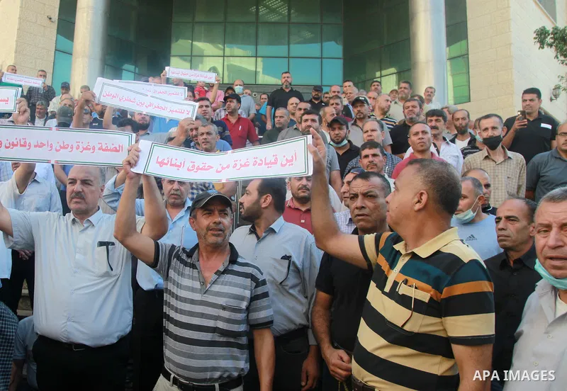 Palestinian military retirees take part in a protest to demand the cancellation of the Mandatory retirement law, in Gaza city, on August 23, 2021. Palestinian Prime Minister Mohammad Shtayyeh previously announced that 6,...