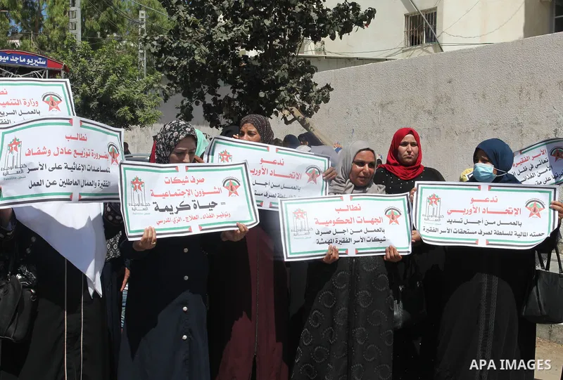 Supporters of the Democratic Front for the Liberation of Palestine, take part in a protest to demand the payment of social affairs allowances, in Gaza city on August 23, 2021. Photo by Youssef Abu Watfa