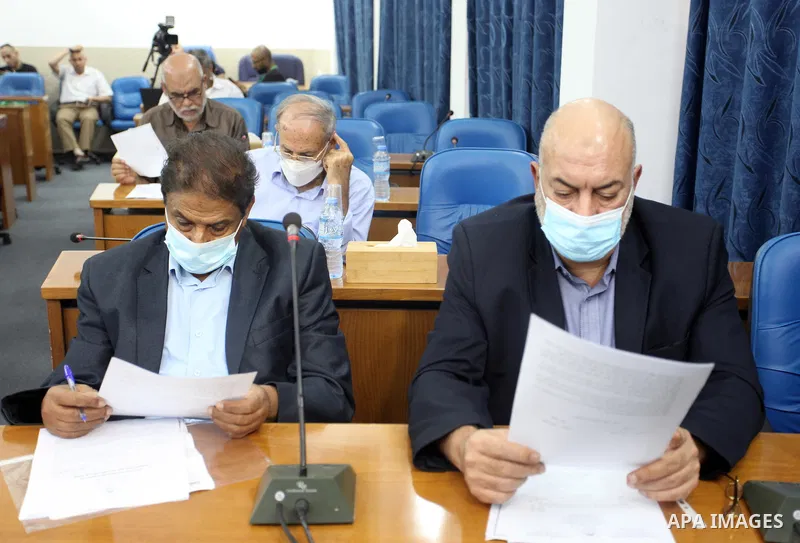 Palestinian Members of Legislative Council, attend a meeting on the 52nd anniversary of the burning of the blessed Al-Aqsa Mosque, at the legislative council, in Gaza city on August 23, 2021. Photo by Youssef Abu Watfa
