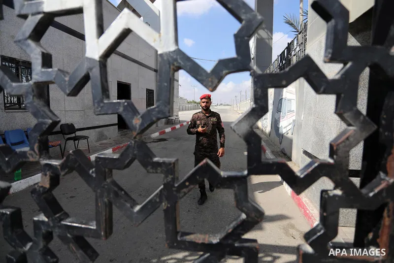 Members of Palestinan security forces stand guard at the closed down Rafah border crossing to Egypt in the southern Gaza Strip, on August 23, 2021. Egypt has told Gaza authorities it will close the Rafah border crossing...