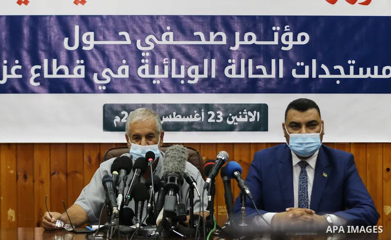 Ashraf al-Qidra, spokesman of the Gaza health ministry, and Director of Preventive Medicine at the Ministry of Health, Majdi Duhair, speak during a press confernce, in Gaza City on August 23, 2021. Palestinian health off...