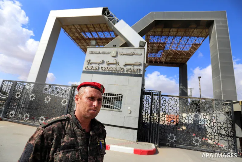 Members of Palestinan security forces stand guard at the closed down Rafah border crossing to Egypt in the southern Gaza Strip, on August 23, 2021. Egypt has told Gaza authorities it will close the Rafah border crossing...