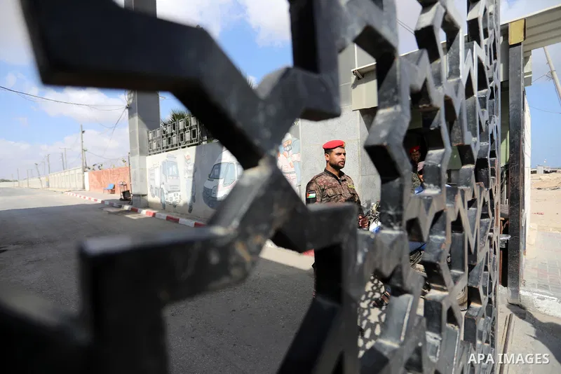 Members of Palestinan security forces stand guard at the closed down Rafah border crossing to Egypt in the southern Gaza Strip, on August 23, 2021. Egypt has told Gaza authorities it will close the Rafah border crossing...