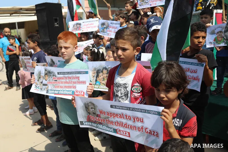 Palestinian children take part in a protest against the Israeli blockade on Gaza Strip, in front of Erez crossing, in Beit Hanoun in the northern Gaza Strip on August 24, 2021. The Israeli blockade of the occupied Gaza S...