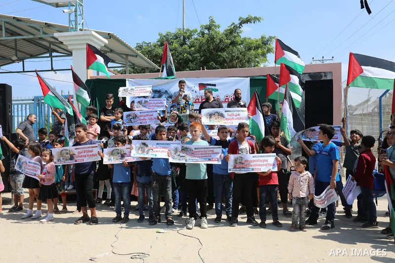 Palestinian children take part in a protest against the Israeli blockade on Gaza Strip, in front of Erez crossing, in Beit Hanoun in the northern Gaza Strip on August 24, 2021. The Israeli blockade of the occupied Gaza S...