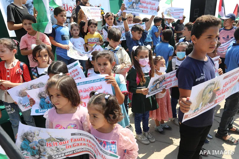 Palestinian children take part in a protest against the Israeli blockade on Gaza Strip, in front of Erez crossing, in Beit Hanoun in the northern Gaza Strip on August 24, 2021. The Israeli blockade of the occupied Gaza S...