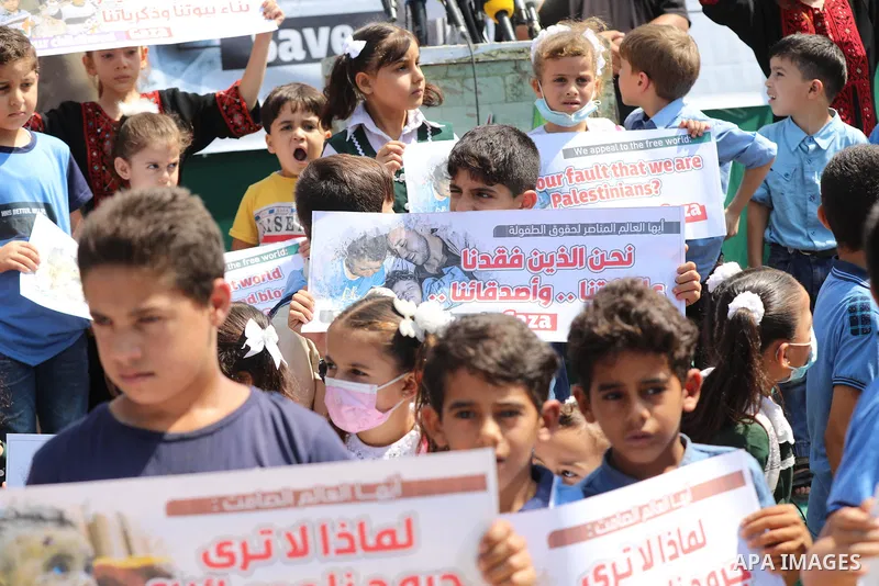 Palestinian children take part in a protest against the Israeli blockade on Gaza Strip, in front of Erez crossing, in Beit Hanoun in the northern Gaza Strip on August 24, 2021. The Israeli blockade of the occupied Gaza S...