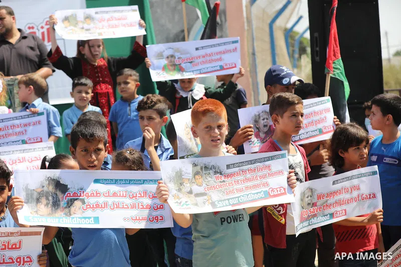 Palestinian children take part in a protest against the Israeli blockade on Gaza Strip, in front of Erez crossing, in Beit Hanoun in the northern Gaza Strip on August 24, 2021. The Israeli blockade of the occupied Gaza S...