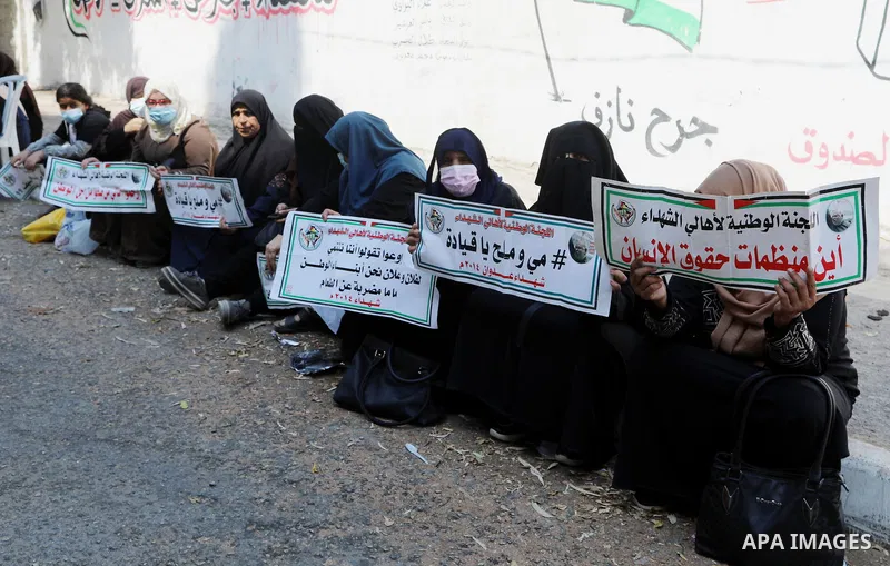 Families of Palestinian martyrs and wounded, take part in a protest against the Palestinian Authority's decision to cut their salaries for seven years, in Gaza City on August 24, 2021. In January 2019, the PA cut the sal...