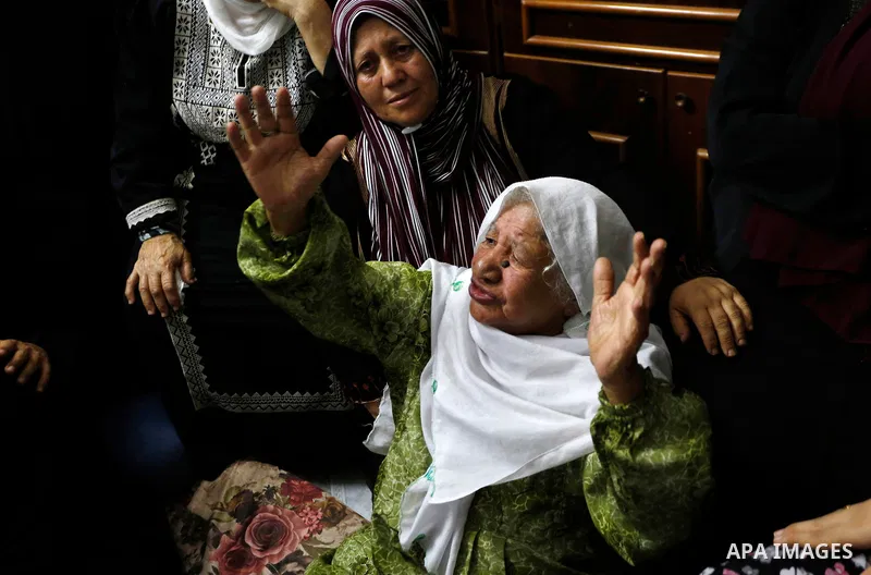 Palestinians attend the funeral of 15-year-old Palestinian Imad Khaled Saleh Hashash at the Balata refugee camp, in the north of the West Bank on August 24, 2021. The Palestinian teenager was killed by Israeli fire early...
